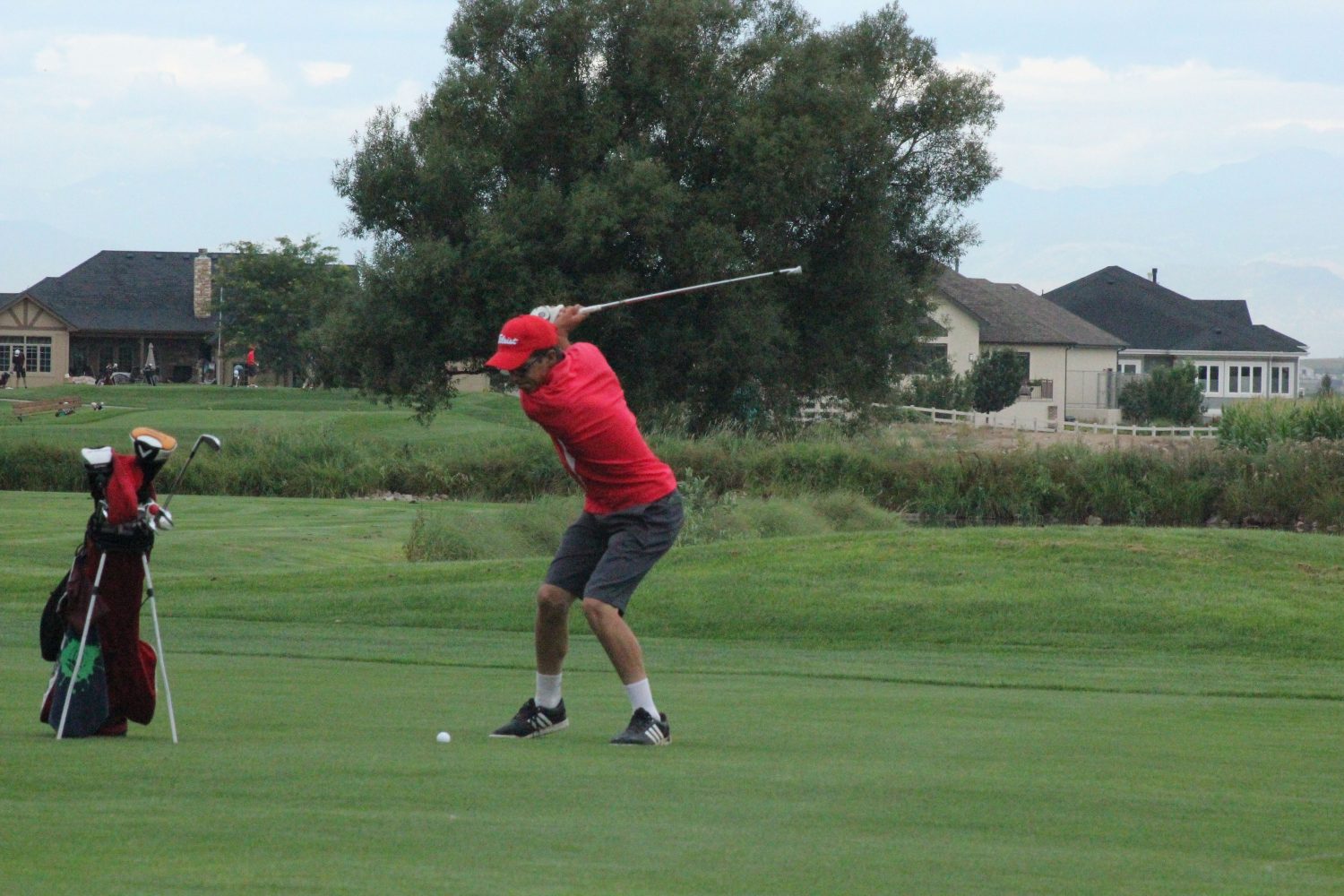 J.D. Truax (14) practices his swing before the competition.