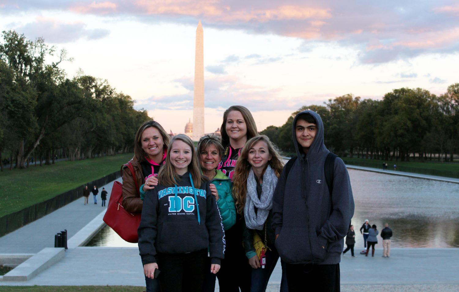 Mrs. Kirby, Hannah Olson (17), Mrs. Jones, Jehna Powell (15), Karalee Kothe (16), and Isaiah Cordova (17) in front of the Washington Monument. 