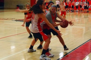 In practice, Hailie Shelden (16) fights to get out of a trap.  