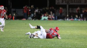 Jake Sandau makes an open field tackle on a University receiver.