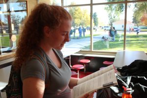 Cheyenne Moyer (18) studies the Colorado Ballot Information Booklet.
