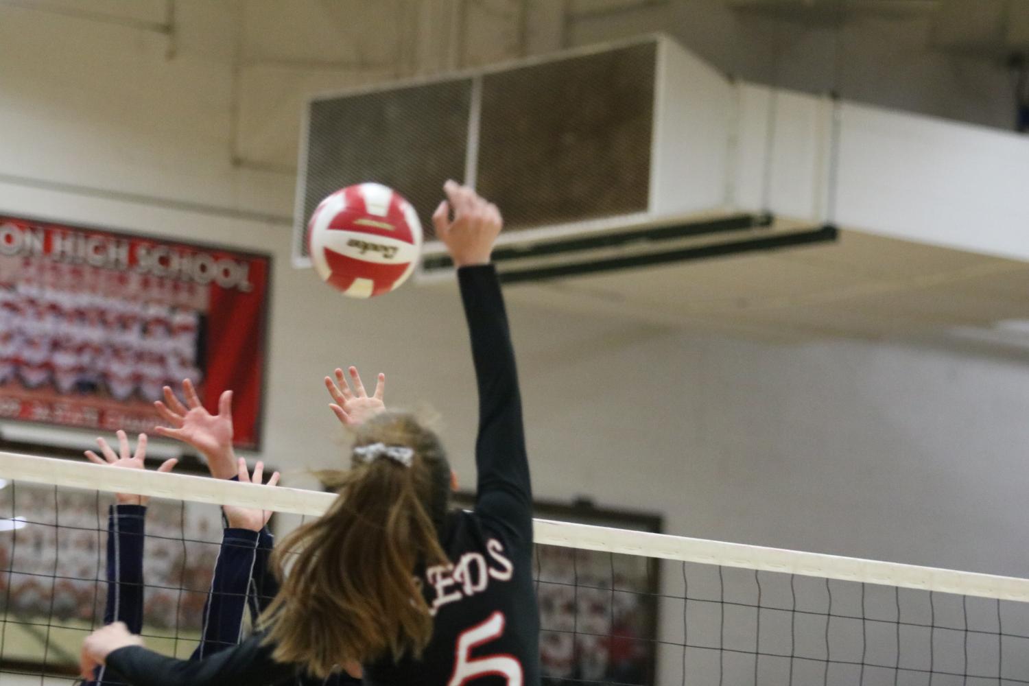 Reds defeat University with help of dependable outside hitter