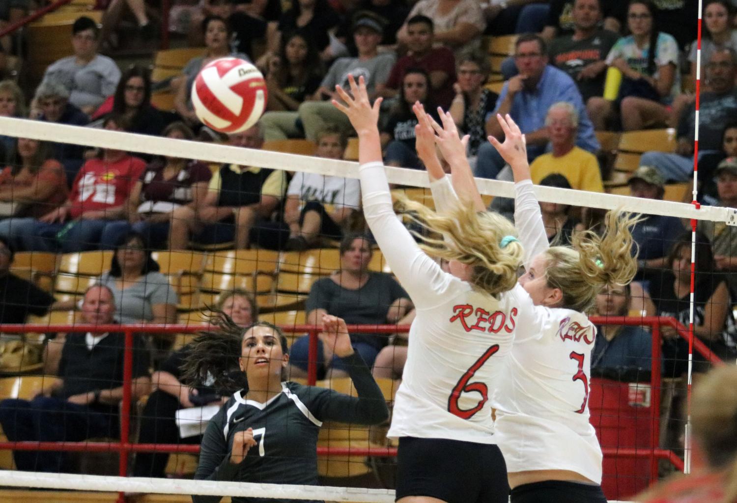 Kennedi Ingram and Darcie Kaiser go up to block an outside attack.