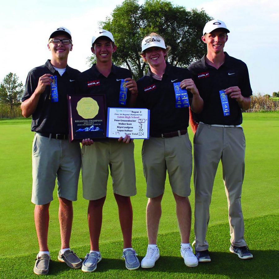 The Eaton golf team holds ribbons and league championship plaque after a win.