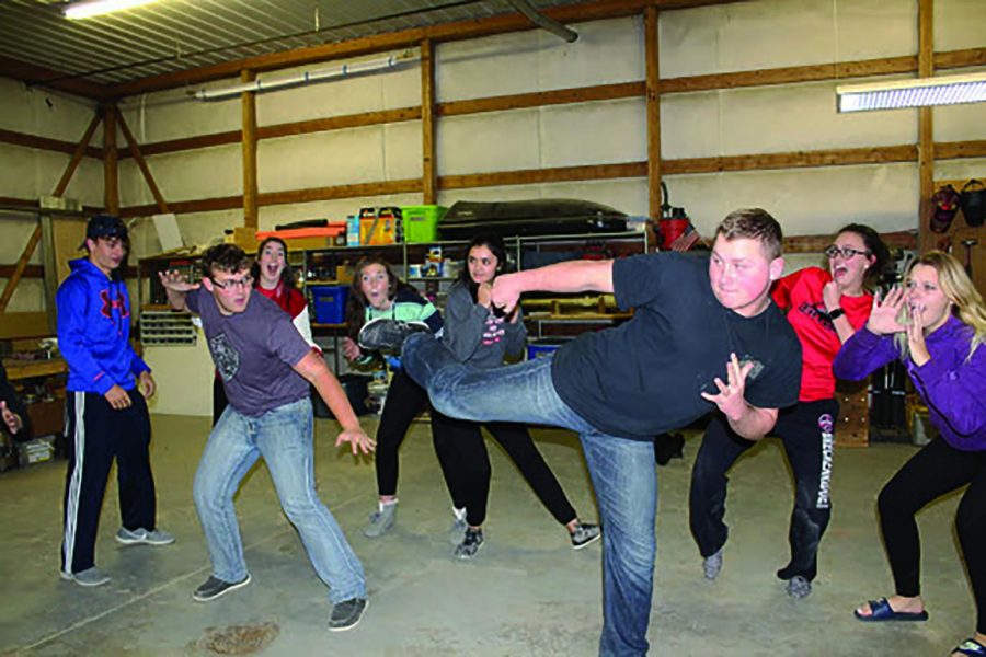 Production holds an impromptu rehearsal to practice lines and a fight scene.