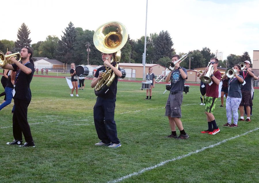 The brass section marches into its next formation during Wednesday nights rehearsal before the Marchathon. Pictured front to back are Austin Decker, Ian Richling, Gabriel Gerkin, Eric Montague, Klara Cordova, Cameron Faust, Abigail Whitaker, Charlotte Reynolds.