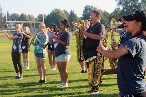 The woodwinds tune in their warm-up arc.