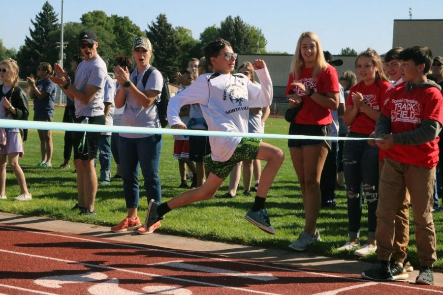 Participant leaps to the finish line
