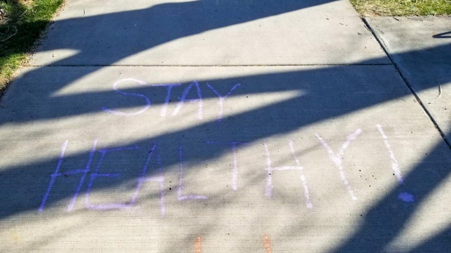Chalk art lining the sidewalk of the Windsor Lake in Windsor, Colorado