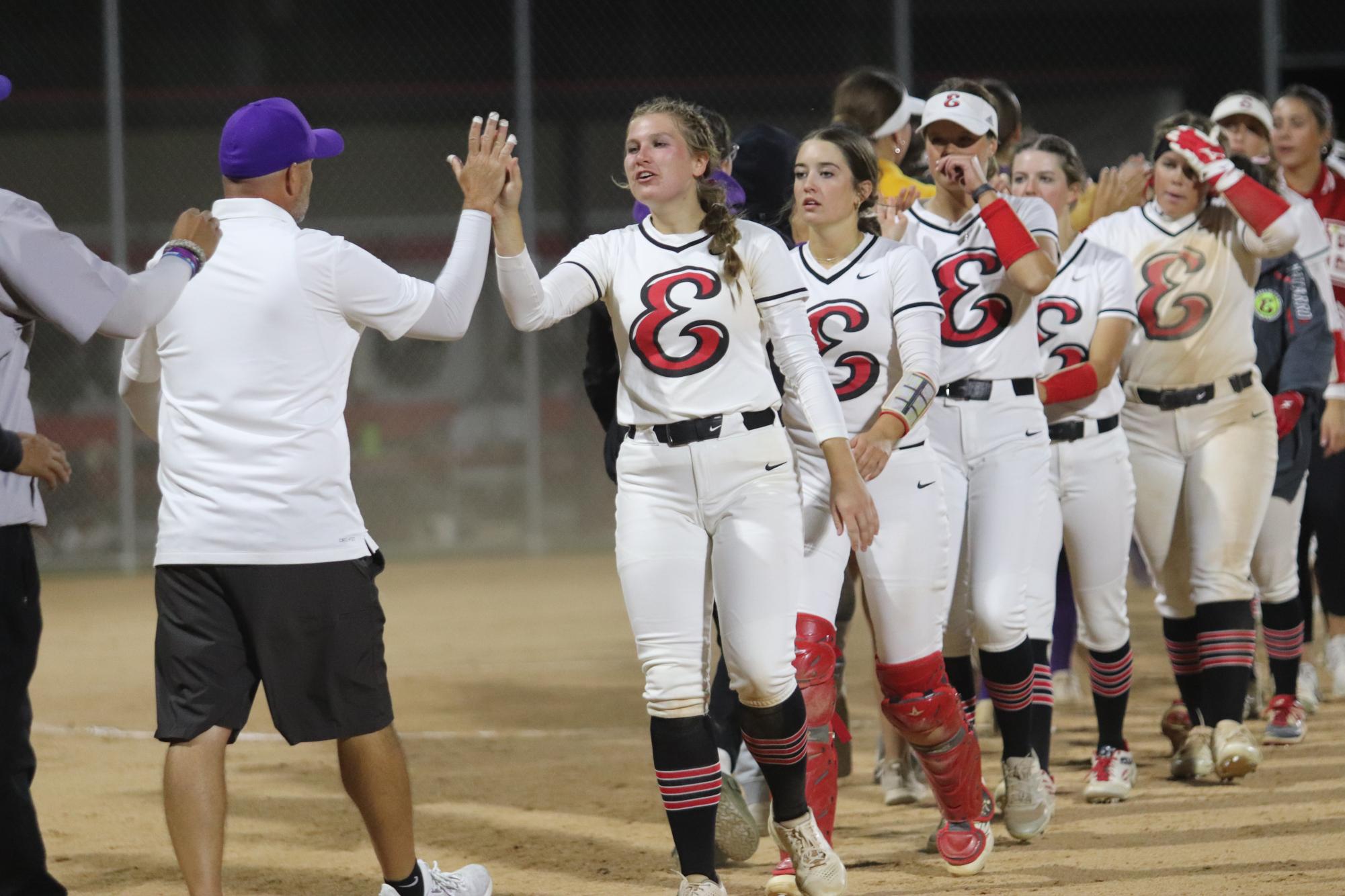 Reds Softball shakes hands with Holy Family after the conclusion of the game