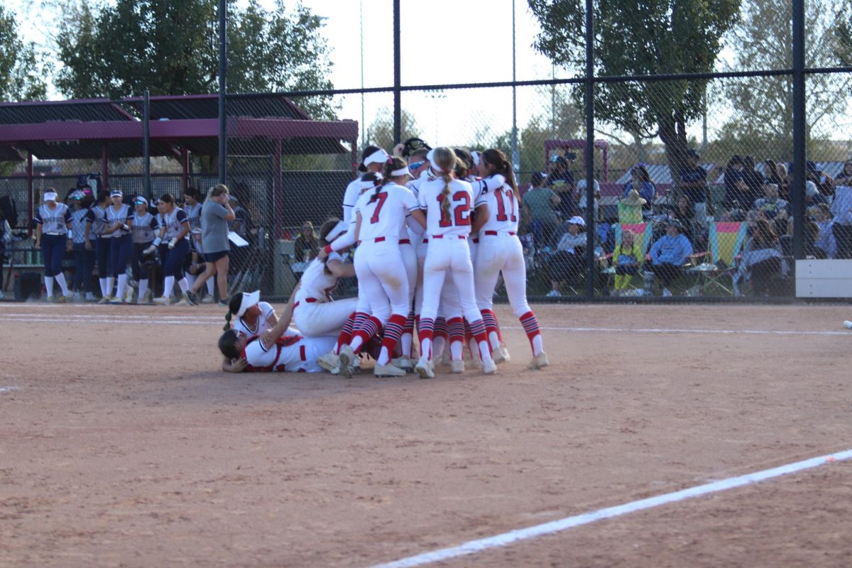 Reds softball join in celebration after clinching the state title 