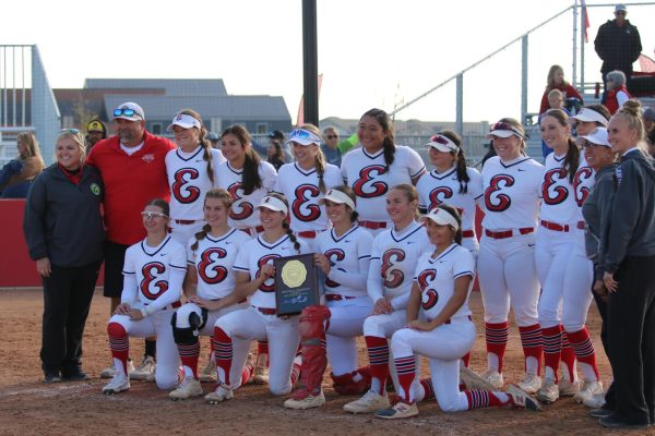 Reds Softball poses with the region championship trophy 