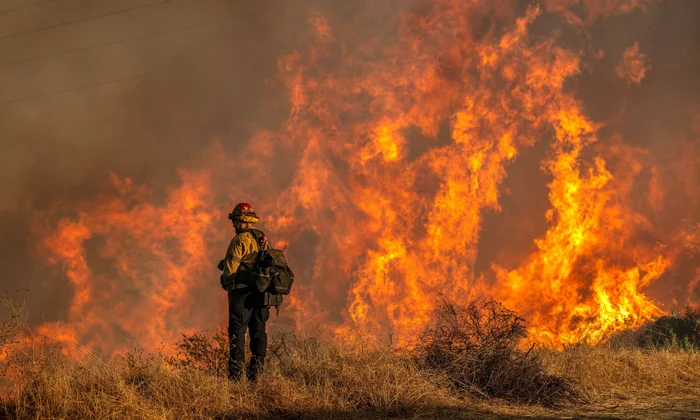 California fires claim lives and destroy thousands of structures